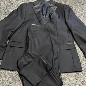 Black slim fit Calvin Klein tuxedo and black satin tie. By Jos. A.Bank Reserve.